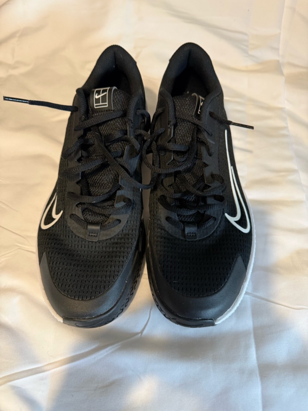 Nike Men's Black Running Sneakers with White Swoosh Accents